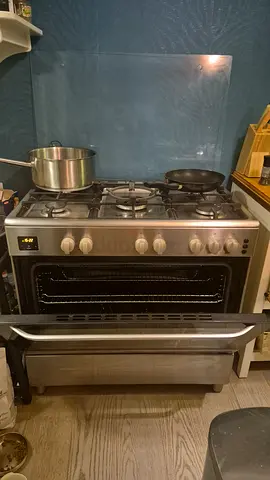 Used stainless steel gas stove with oven - good working condition