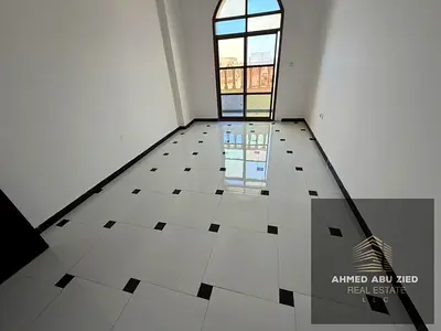 One bedroom and living room for annual rent in Ajman, Al Rawda 3, next to Sheikh Ammar Street. Includes a balcony, central air conditioning,