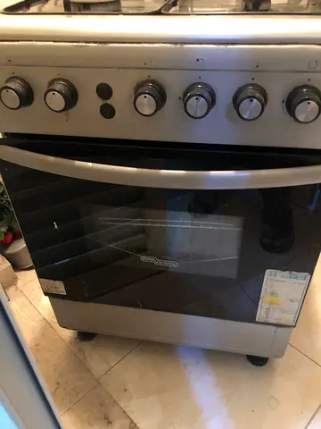 Used stainless steel freestanding gas oven with four burners
