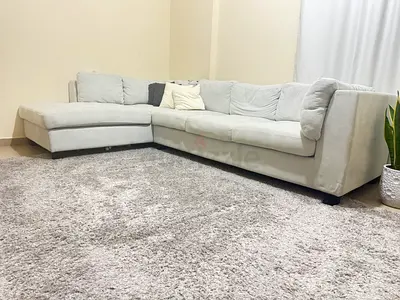 Light grey L-shaped sectional sofa - 3-seater with chaise and carpet
