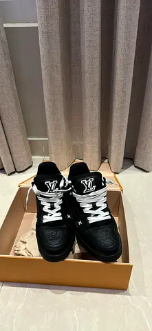 Black Louis Vuitton high-top sneakers, gently used (size 6)