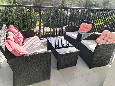 Outdoor rattan patio sofa set with glass coffee table — seats 4