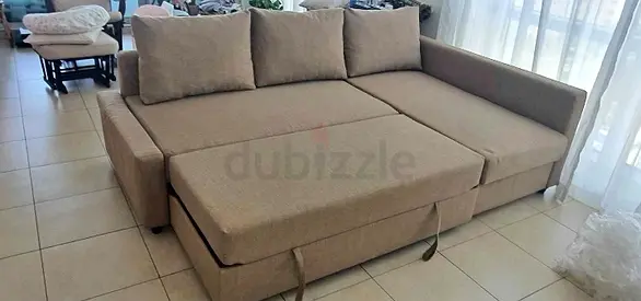 Beige L-shaped Sofa Bed with Storage - Comfortable Seater, Good Condition