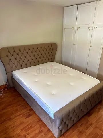 Queen upholstered bed with mattress - beige, good condition
