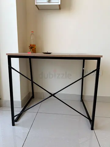 Simple industrial-style study desk with metal frame