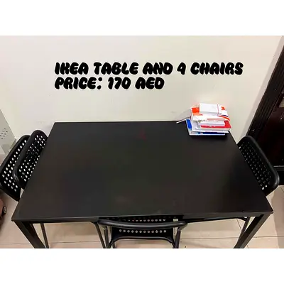 IKEA black dining table with 4 matching chairs - good condition