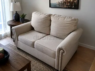 Beige 2-Seater Sofa with Nailhead Trim - Good Condition