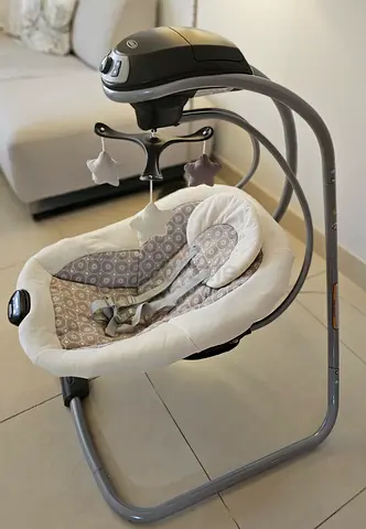 Baby electric swing and rocker - gentle motion with toys (used)