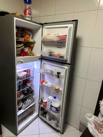 Used double-door refrigerator with freezer - good working condition