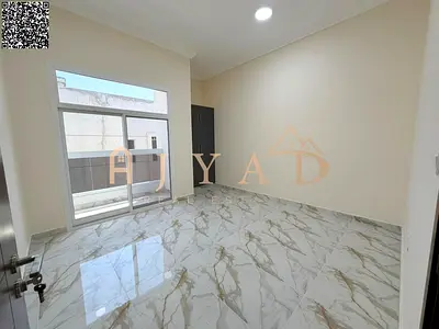 2BR hall for annual rent in a new building, first tenant in Al Mowaihat 3. Free month, central gas/AC, free kitchen appliances, wardrobes, balcony.