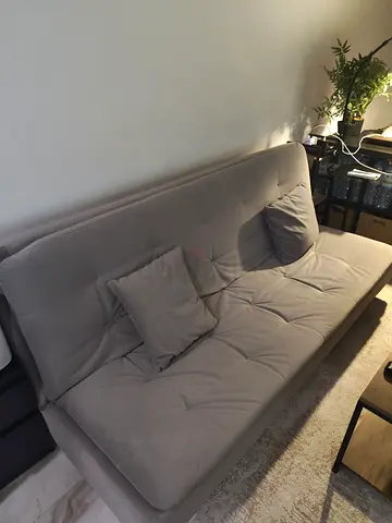 Light grey fabric sofa bed (3-seater) with cushions