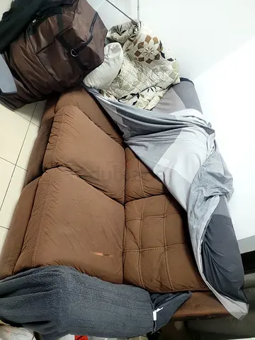Brown 3-seater sofa / futon in used condition