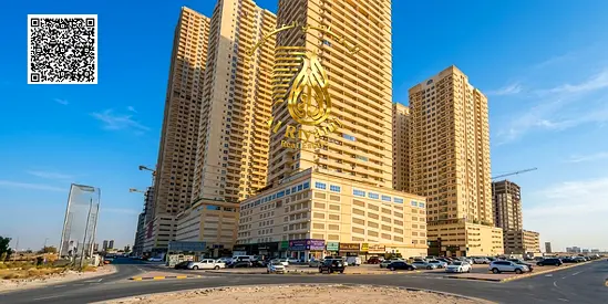 Two-bedroom apartment with a spacious living room in Emirates City, with parking and gym.