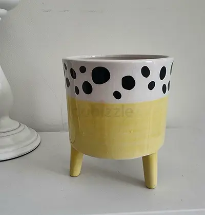Hand-painted ceramic planter pot with legs — yellow  white polka dot