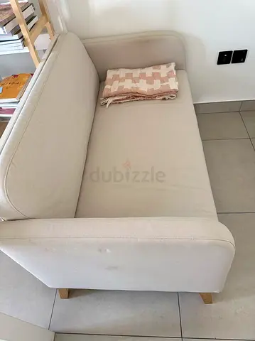 Light Beige Two-Seater Sofa — Compact, Good Condition