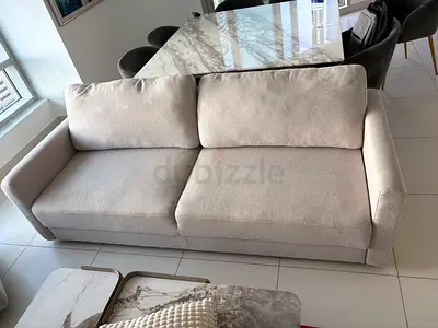 Light beige 2.5-seater fabric sofa bed — good condition