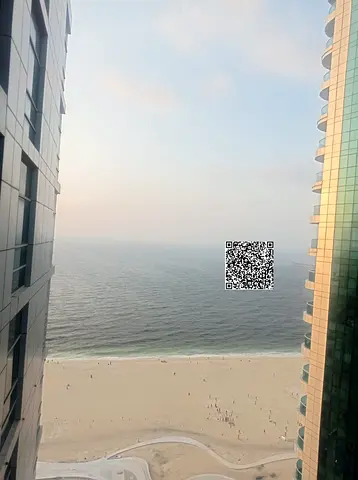 Two bedrooms and a living room for annual rent in Corniche Tower with a sea view