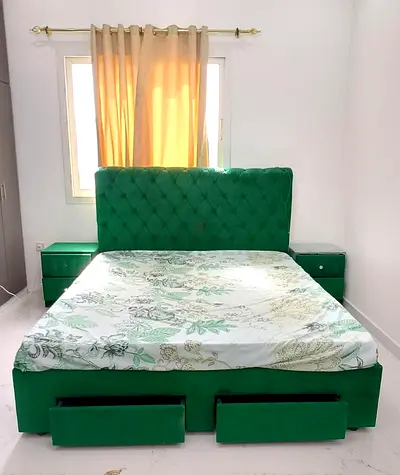 Green Upholstered Bed with Storage Drawers and Matching Nightstands
