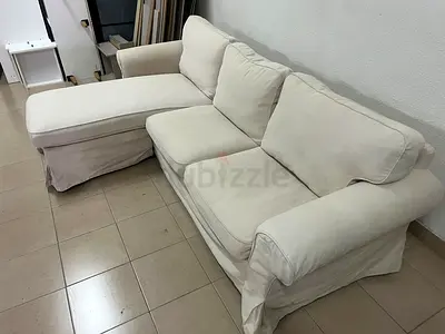 IKEA three-seater sofa with a beige chaise lounge from IKEA