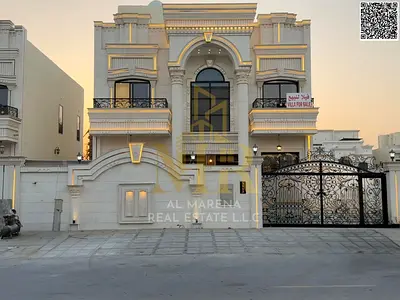 Luxury villa for sale in Al Helio 2 | 3850 sq ft | Two floors + roof | 6 master bedrooms | Majlis and living room with washrooms | Modern kitchen | Ro