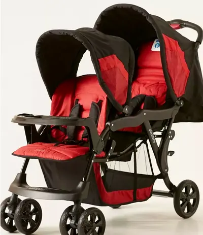 Heavy duty Double Stroller - Red/Black, Good Condition colour lightly faded it has strong metal body