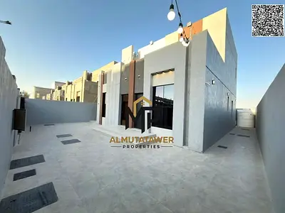 Luxury villa for sale, two floors + roof, with a modern design and spacious areas, with a large yard and patio, located near Sheikh Mohammed Bin Zayed