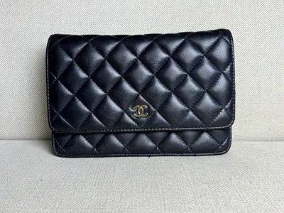 Chanel Classic Wallet on Chain in black Lambskin leather.