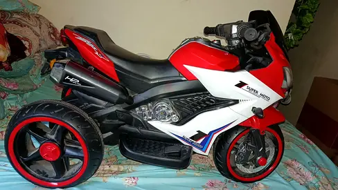 Kids charging bike .sale urgent tow days