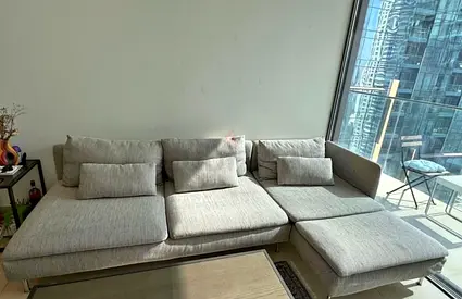 Light grey L-shaped fabric sofa with chaise - good condition