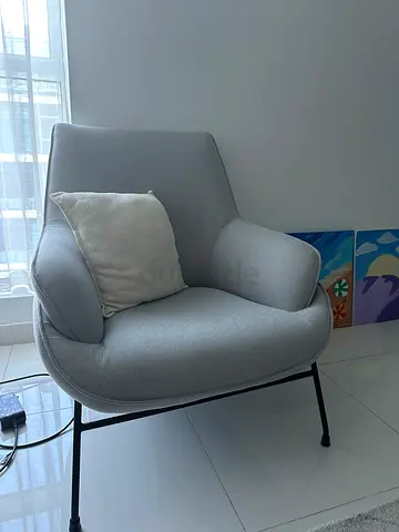 Light grey upholstered accent lounge chair with metal legs