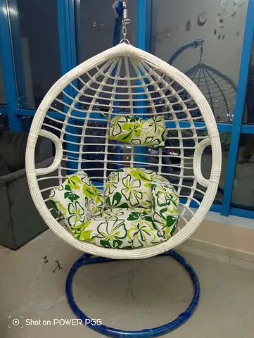 White Rattan Hanging Egg Chair with Green Floral Cushions