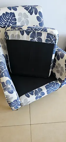 Single upholstered armchair with blue floral pattern - good condition