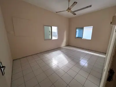 The cheapest two-bedroom apartment in Al Rumaila 1, near Ajman Corniche. Spacious, with a balcony and a fantastic location suitable for families, at a