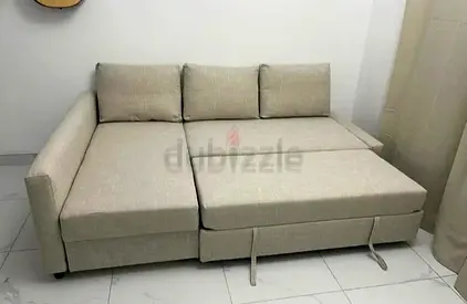 Beige L-shaped Sofa Bed - Converts to Double Bed, Good Condition