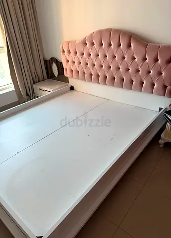 Queen bed frame with tufted pink velvet headboard - good condition