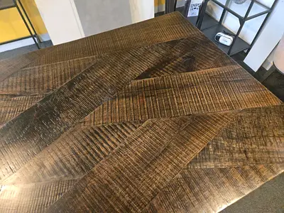 Solid reclaimed wood dining table top with chevron parquet pattern