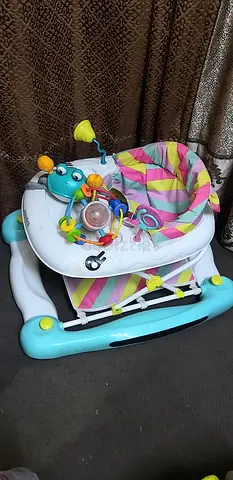 Baby walker with activity tray and toys - good condition