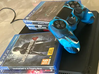 Sony PS4 Slim with controller + 5 PS4 games (Excellent working condition no damage) Price negotiable