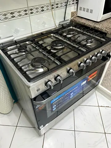 Stainless Steel 5-Burner Gas Range with Oven - Good Condition new dinning table and refrigerator