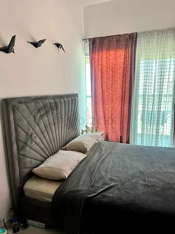 Queen-size upholstered bed with padded headboard - grey