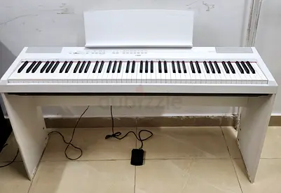 The Yamaha P-115 is a discontinued 88-key weighted digital piano featuring the Pure CF Sound Engine,