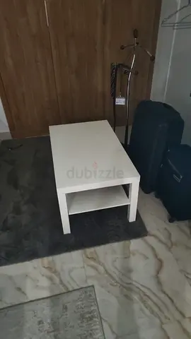Simple white coffee table with lower shelf - good condition