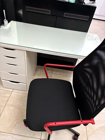 Used black mesh office chair with red frame — good condition