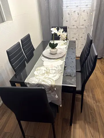 Glass Top Dining Table with 6 Black Faux Leather Chairs