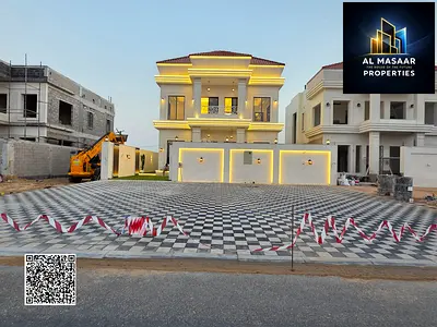 Corner villa for sale in Ajman, two floors and a roof, located on two streets with a large setback in a prime residential location.