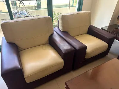Pair of Brown  Cream Leather sofa set. 3+2+1+1