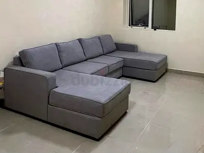 Light grey L-shaped fabric sectional sofa - 4 seater with chaise