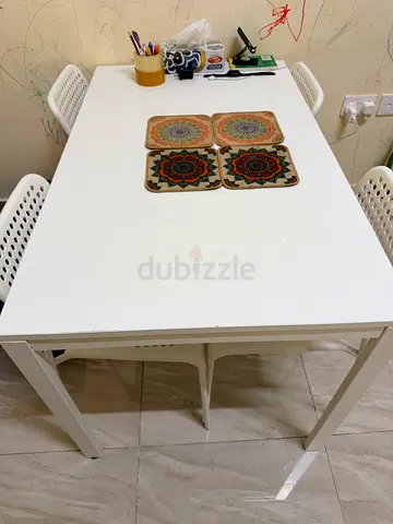 Simple white rectangular dining table  with four chairs good condition