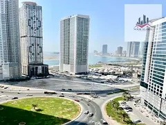 Sharjah, Al Taawun area: One bedroom apartment with living room, kitchen, two bathrooms, and balcony