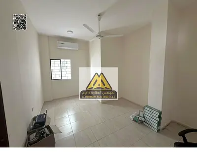 Studio in Al Nakhil 1, ground floor, separate kitchen, split AC, second row from the Corniche. AED 20,000 in 6 installments. Prime location close to s